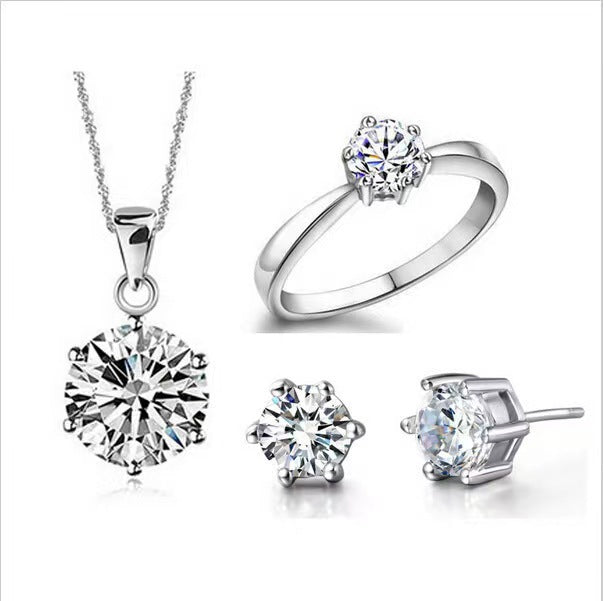 Six-prong ring, necklace, and earrings